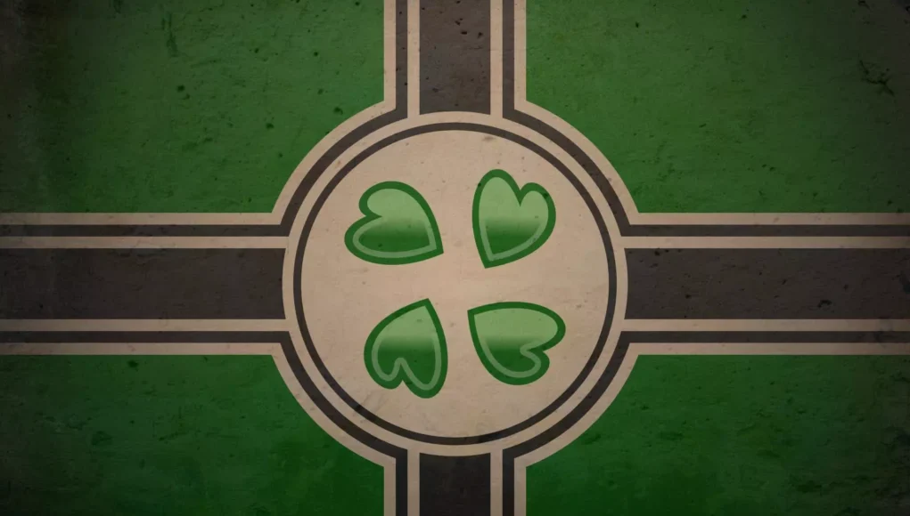 Ilustración de una bandera estilizada en tonos verde, negro y beige. En el centro hay un círculo con cuatro corazones verdes orientados como los pétalos de un trébol. La composición recuerda a una cruz nórdica, con líneas negras y bordes claros que se extienden horizontal y verticalmente desde el centro.