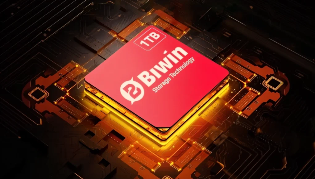 Chip de almacenamiento Biwin de 1TB iluminado con efectos dorados sobre una placa base electrónica, representando tecnología avanzada de almacenamiento digital.