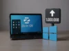 Casi un millón de usuarios de Windows se mudan a Linux tras el fin del soporte de Windows 10 Un portátil mostrando la pantalla de inicio de Zorin OS sobre una mesa, acompañado a la derecha por un cartel oscuro con una flecha ascendente y el número “1.000.000”, junto a un logotipo azul de Windows dividido en cuatro paneles.